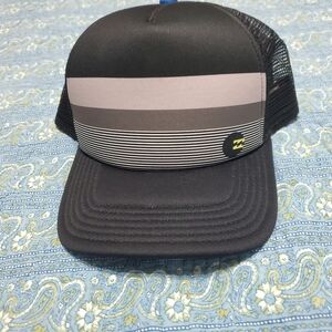 Hat . By billabong. Snap back, so will fit most sizes. Color is black grey blue.